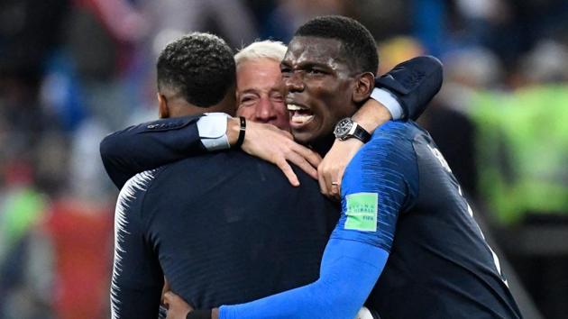 France's coach Didier Deschamps (C) celebrates with France's midfielder Paul Pogba (R) at the end of the FIFA World Cup 2018 semi-final against Belgium at the Saint Petersburg Stadium.(AFP)