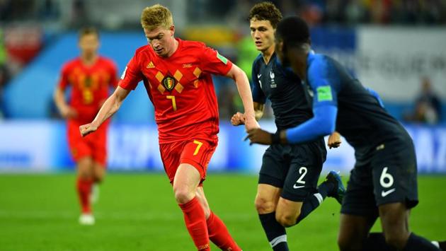 Belgium's Kevin De Bruyne in action with France's Benjamin Pavard. (REUTERS) Belgium's Kevin De Bruyne in action with France's Benjamin Pavard. (REUTERS)