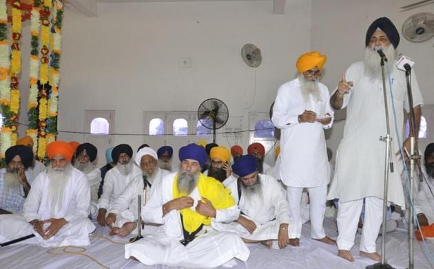 SAD leader and former MLA Virsa Singh Valtoha (on mic) during the death anniversary function of Khalistan Commando Force (KCF) chief Labh Singh at Panwar village in Tarn Taran on Thursday.(HT Photo)