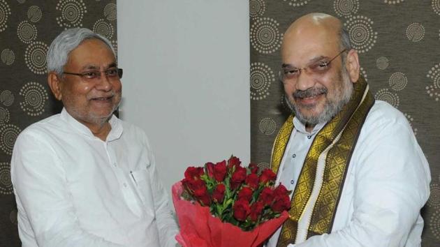 Bihar chief minister Nitish Kumar (left) greets BJP president Amit Shah in Patna on Thursday morning. The two leaders held a breakfast meeting and will meet again at a dinner hosted by Kumar at his residence. (AP Dube/HT Photo) Bihar chief minister Nitish Kumar (left) greets BJP president Amit Shah in Patna on Thursday morning. The two leaders held a breakfast meeting and will meet again at a dinner hosted by Kumar at his residence. (AP Dube/HT Photo)