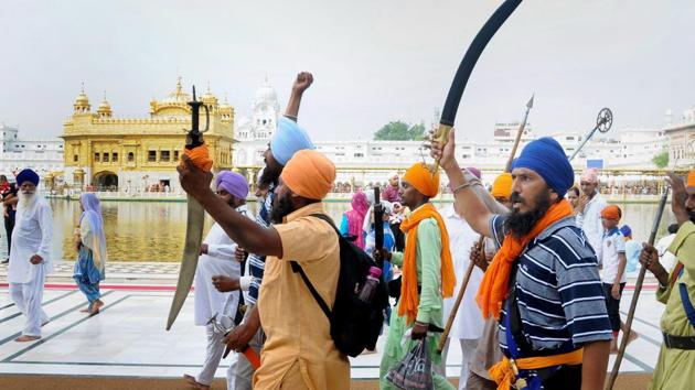 People shout pro-Khalistan slogans at a demonstration marking the 34th anniversary of the Operation Blue Star, at Golden Temple in Amritsar. (PTI File Photo) People shout pro-Khalistan slogans at a demonstration marking the 34th anniversary of the Operation Blue Star, at Golden Temple in Amritsar. (PTI File Photo)