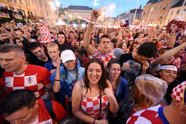 Croatia's supporters react as they watch on a giant screen the Russia 2018 World Cup semi-final football match between Croatia and England, at the main square in Zagreb, Croatia on July 11, 2018(AFP)