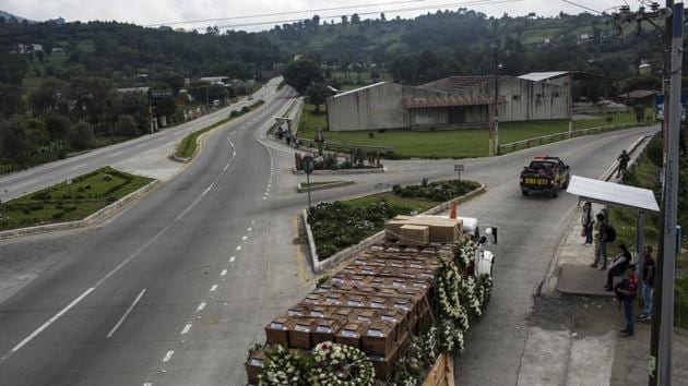 A cargo truck transports the remains of 172 unidentified people who were exhumed from a former military base in San Juan Comalapa, Guatemala. Forensic anthropologists and villagers unearthed the bodies in 2003 at the former base, where three of the graves remain open as a symbol of the massacre. (Rodrigo Abd / AP) A cargo truck transports the remains of 172 unidentified people who were exhumed from a former military base in San Juan Comalapa, Guatemala. Forensic anthropologists and villagers unearthed the bodies in 2003 at the former base, where three of the graves remain open as a symbol of the massacre. (Rodrigo Abd / AP)