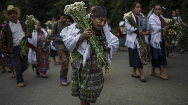 The United Nations has documented the disappearance of 45,000 people during the 36 years of civil war in Guatemala, and the murder of another 200,000. Since 2003, forensic anthropologists have dug up at least 220 individual remains, but only about a quarter could be matched to relatives. Those unidentified have now been interred at the forest location. (Rodrigo Abd / AP) The United Nations has documented the disappearance of 45,000 people during the 36 years of civil war in Guatemala, and the murder of another 200,000. Since 2003, forensic anthropologists have dug up at least 220 individual remains, but only about a quarter could be matched to relatives. Those unidentified have now been interred at the forest location. (Rodrigo Abd / AP)