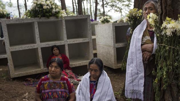 Women attend the funeral ceremony. A place is also reserved for renowned US anthropologist Clyde Snow, who worked on disappearances in Guatemala before his own death in 2014. “He asked in his will for his remains to rest here in Comalapa,” said Rosalina Tuyuc, who lost her husband and father and came to lead a national organization of Kakchikel widows demanding justice. (Rodrigo Abd / AP) Women attend the funeral ceremony. A place is also reserved for renowned US anthropologist Clyde Snow, who worked on disappearances in Guatemala before his own death in 2014. “He asked in his will for his remains to rest here in Comalapa,” said Rosalina Tuyuc, who lost her husband and father and came to lead a national organization of Kakchikel widows demanding justice. (Rodrigo Abd / AP)