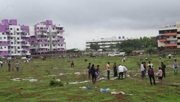 Within two to three hours, residents demarcated the entire 50 acres with clothes, stones, and whatever they had.(HT PHOTO)