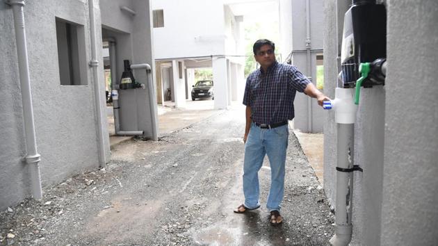 Amit Joshi, secretary, Saidatt Residency showing the rainwater harvesting system in Saidatt residency, Baner.(HT PHOTO)