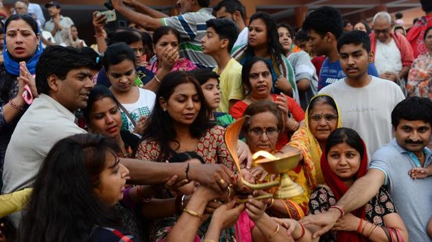 In this picture taken on June 17, 2018, devotees perform a ritual on the banks of the river Ganga in Rishikesh.(AFP) In this picture taken on June 17, 2018, devotees perform a ritual on the banks of the river Ganga in Rishikesh.(AFP)