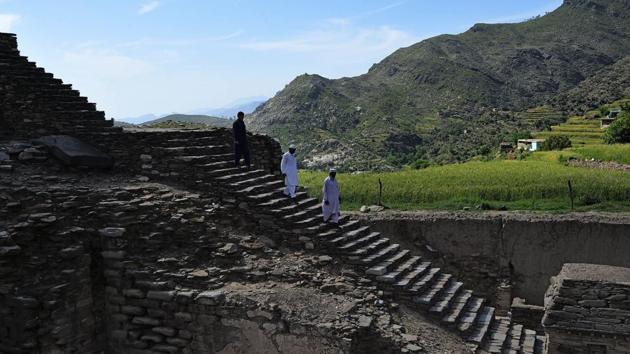 Visitors walk down stairs to see a centuries-old stupa. Buddhism for its part disappeared from the region around the 10th century AD, driven out by Islam and Hinduism. Its golden age in Swat lasted from the second to the fourth centuries, when more than 1,000 monasteries, sanctuaries and stupas spread out in constellations across the valley. (Abdul Majeed / AFP) Visitors walk down stairs to see a centuries-old stupa. Buddhism for its part disappeared from the region around the 10th century AD, driven out by Islam and Hinduism. Its golden age in Swat lasted from the second to the fourth centuries, when more than 1,000 monasteries, sanctuaries and stupas spread out in constellations across the valley. (Abdul Majeed / AFP)