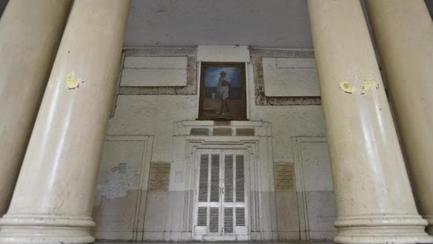 As one enters the building, a portrait of Mahatma Gandhi and the mayor’s symbolic key to the city greets visitors. Rooms that were once offices of civic officials are now covered in dust and the crumbling walls speak of a bygone age. Built with funds collected as subscription from Indian citizens, the Town hall was initially known as the Lawrence Institute before the municipality bought it. (Sanchit Khanna / HT Photo) As one enters the building, a portrait of Mahatma Gandhi and the mayor’s symbolic key to the city greets visitors. Rooms that were once offices of civic officials are now covered in dust and the crumbling walls speak of a bygone age. Built with funds collected as subscription from Indian citizens, the Town hall was initially known as the Lawrence Institute before the municipality bought it. (Sanchit Khanna / HT Photo)