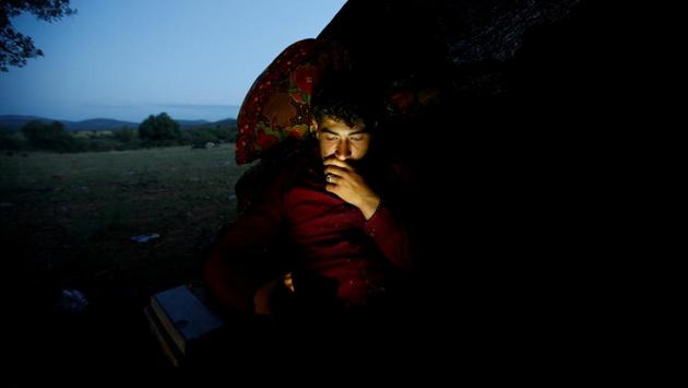 Muhammet Gobut sits inside their tent while looking at his phone near Konya. “I had a social life in college ... (and) I could go to the hospital whenever I needed to”, Gulay said. “But none of these exist in the nomadic life. We are alone with nature.” (Osman Orsal / REUTERS) Muhammet Gobut sits inside their tent while looking at his phone near Konya. “I had a social life in college ... (and) I could go to the hospital whenever I needed to”, Gulay said. “But none of these exist in the nomadic life. We are alone with nature.” (Osman Orsal / REUTERS)