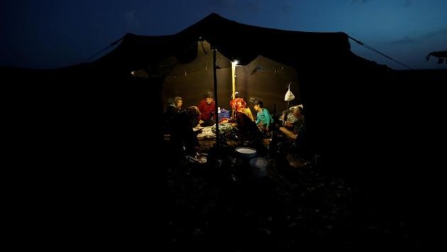The Gobut family eat a meal inside their tent near Konya. More Yoruk families choose to leave their nomadic life behind as water becomes scarce and farmers and villagers become more hostile. Sometimes they even take goats hostage when the Yoruks enter their land. “There are days when we have to migrate quickly at night on asphalt for hours while the main roads are still empty,” Savran said. (Osman Orsal / REUTERS) The Gobut family eat a meal inside their tent near Konya. More Yoruk families choose to leave their nomadic life behind as water becomes scarce and farmers and villagers become more hostile. Sometimes they even take goats hostage when the Yoruks enter their land. “There are days when we have to migrate quickly at night on asphalt for hours while the main roads are still empty,” Savran said. (Osman Orsal / REUTERS)