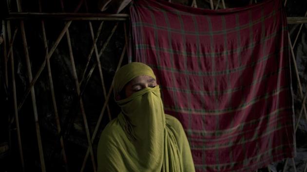 “D” recounts her experience of the rape which she endured being so severe, that she had to wrap a supportive scarf around her battered pelvis to endure the days-long walk to Bangladesh, as she speaks to The Associated Press in her shelter in Kutupalong refugee camp, Bangladesh. (Wong Maye-E / AP)