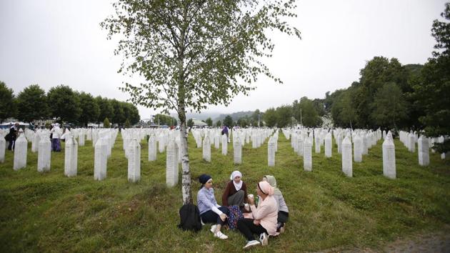 Bosnian Muslim women sit at the cemetery at the memorial centre of Potocari near Srebrenica, 150 kms north east of Sarajevo, Bosnia. Thousands of Bosnian Muslims gathered in Srebrenica on the 23rd anniversary of Europe’s worst massacre since World War II to hold prayers and attend the funeral for 35 recently identified victims. (Amel Emric / AP) Bosnian Muslim women sit at the cemetery at the memorial centre of Potocari near Srebrenica, 150 kms north east of Sarajevo, Bosnia. Thousands of Bosnian Muslims gathered in Srebrenica on the 23rd anniversary of Europe’s worst massacre since World War II to hold prayers and attend the funeral for 35 recently identified victims. (Amel Emric / AP)