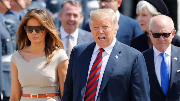 US President Donald Trump (C) and First Lady Melania Trump (L) walk on the tarmac with US Ambassador to the United Kingdom Woody Johnson (R) as they disembark Air Force One at Stansted Airport, north of London on Thursday as he begins his first visit to the UK as US president. (AFP) US President Donald Trump (C) and First Lady Melania Trump (L) walk on the tarmac with US Ambassador to the United Kingdom Woody Johnson (R) as they disembark Air Force One at Stansted Airport, north of London on Thursday as he begins his first visit to the UK as US president. (AFP)