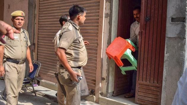 Delhi Police takes away the stools, which were supposed to be used by the Bhatia family members while committing suicide, at Burari in New Delhi on Friday, July 6, 2018. (PTI File Photo) Delhi Police takes away the stools, which were supposed to be used by the Bhatia family members while committing suicide, at Burari in New Delhi on Friday, July 6, 2018. (PTI File Photo)