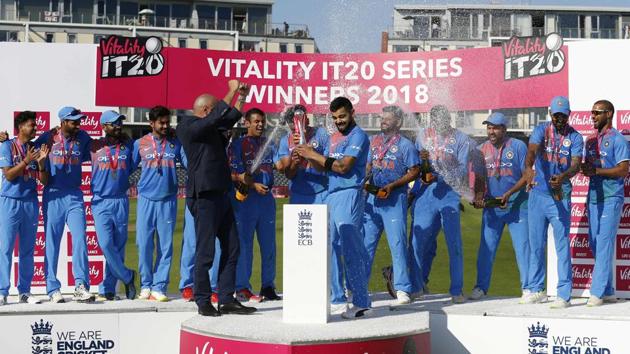Champagne is sprayed as Indian players celebrate with the series trophy after the third international Twenty20 cricket match against England at The Brightside Ground, Bristol on July 8, 2018. (AFP) Champagne is sprayed as Indian players celebrate with the series trophy after the third international Twenty20 cricket match against England at The Brightside Ground, Bristol on July 8, 2018. (AFP)