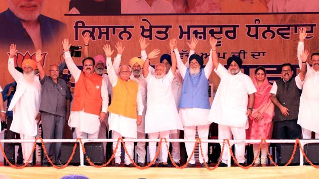 Prime Minister Narendra Modi with Ex Chief Minister Parkash Singh Badal CM Haryana Manohar Lal Khattad,SAD President Sukhbir SIngh Badal,waves at crowd at the "KIsan Kalyan Rally"of SAD - BJP in Malout in Muktsar district on Wednesday. (Sanjeev Kumar/HT Photo) Prime Minister Narendra Modi with Ex Chief Minister Parkash Singh Badal CM Haryana Manohar Lal Khattad,SAD President Sukhbir SIngh Badal,waves at crowd at the "KIsan Kalyan Rally"of SAD - BJP in Malout in Muktsar district on Wednesday. (Sanjeev Kumar/HT Photo)