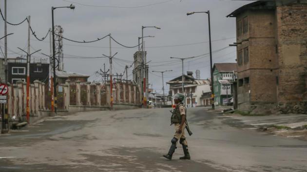 An Indian paramilitary soldier walks on a deserted road during curfew in Srinagar. Two CRPF jawans were killed and one injured in a militant attack in Jammu and Kashmir’s Anantnag district on Friday, official sources said. The area has been cordoned off and a hunt launched to track down the assailants. (Dar Yasin / AP)