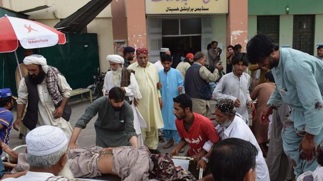 A victim of a bomb blast is brought to a hospital in Quetta on July 13, 2018 following an attack at an election rally.(AFP Photo)