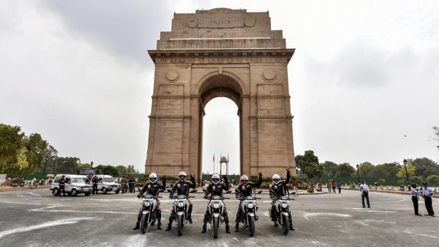 Members of the Indian Army's Shwet Ashwa team pose for a group photo at India Gate upon their arrival for the celebrations of Kargil War victory in New Delhi on Friday. (Ravi Choudhary / PTI)