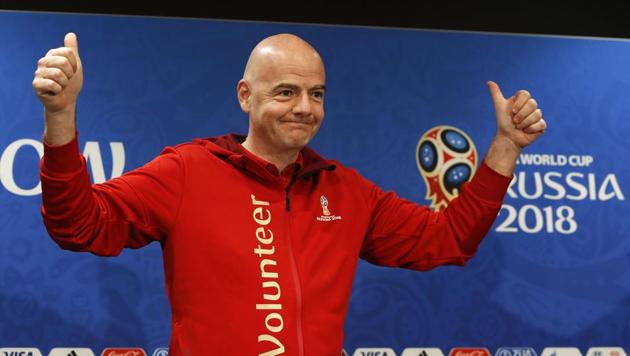 FIFA President Gianni Infantino greets the audience as he attends a news conference at the Luzhniki Stadium in Moscow on Friday.(Reuters)