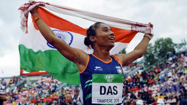 Hima Das celebrates her victory in women's 400 meter race at the 2018 IAAF World U20 Championships in Tampere, Finland.(AP)