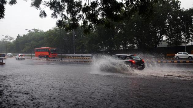Commuters wade through heavy rainfall near Turkman gate, New Delhi. (Amal KS/HT Photo) Commuters wade through heavy rainfall near Turkman gate, New Delhi. (Amal KS/HT Photo)