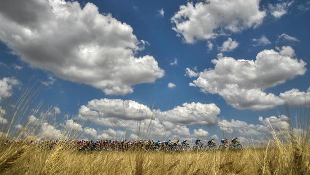 The pack rides through the countryside during the first stage of the 105th edition of the Tour de France cycling race between Noirmoutier-en-l'ile and Fontenay-le Comte, western France. (Marco Bertorello / AFP) The pack rides through the countryside during the first stage of the 105th edition of the Tour de France cycling race between Noirmoutier-en-l'ile and Fontenay-le Comte, western France. (Marco Bertorello / AFP)