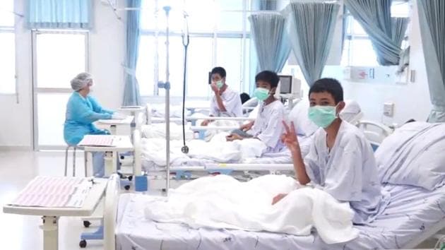 Members of the “Wild Boars” football team being treated at a hospital in Chiang Rai. The 12 boys rescued from a Thai cave were passed “sleeping” on stretchers through the treacherous passageways, a former Thai Navy SEAL told AFP on July 11, giving the first clear details of an astonishing rescue mission that has captivated the world. (Thai Government / Handout / AFP) Members of the “Wild Boars” football team being treated at a hospital in Chiang Rai. The 12 boys rescued from a Thai cave were passed “sleeping” on stretchers through the treacherous passageways, a former Thai Navy SEAL told AFP on July 11, giving the first clear details of an astonishing rescue mission that has captivated the world. (Thai Government / Handout / AFP)