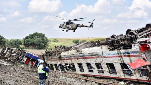 A helicopter flies over the site where a train derailed at Corlu district in Tekirdag, northwest Turkey. (DHA / AFP) A helicopter flies over the site where a train derailed at Corlu district in Tekirdag, northwest Turkey. (DHA / AFP)
