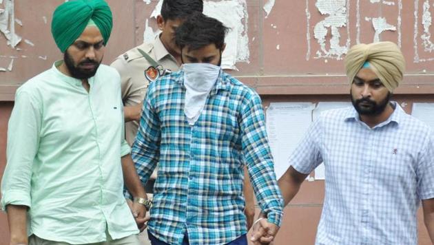 The accused being produced at the Mohali district court. (HT Photo) The accused being produced at the Mohali district court. (HT Photo)