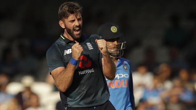 England's Liam Plunkett celebrates taking the wicket of India wicketkeeper M.S. Dhoni. (AP)