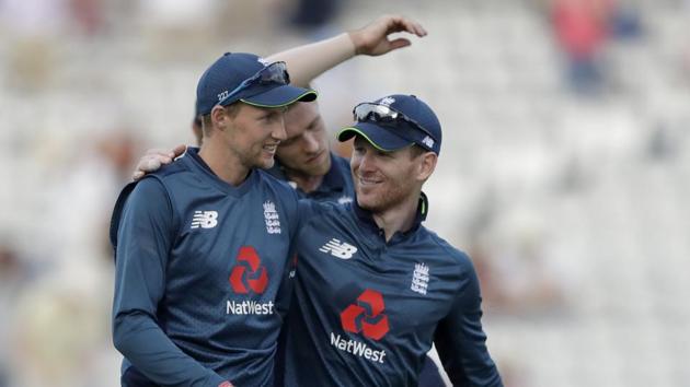 England's Joe Root, left, and England captain Eoin Morgan walk off the field of play at the end of the one day cricket match between England and India at Lord's cricket ground in London, Saturday, July 14, 2018. (AP)