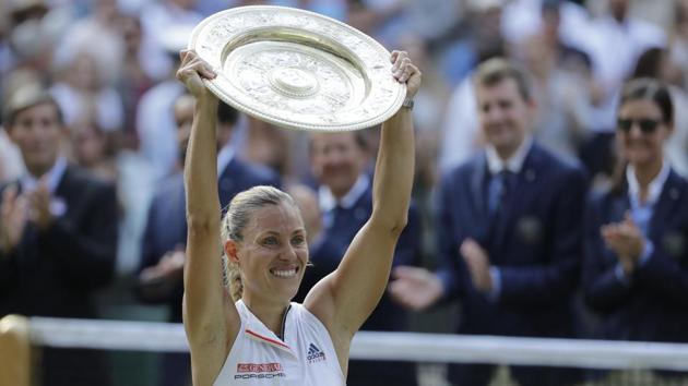 Germany's Angelique Kerber lifts the trophy after winning the women's singles final match against Serena Williams of the United States, at the Wimbledon Tennis Championships, in London, Saturday July 14, 2018.(AP)