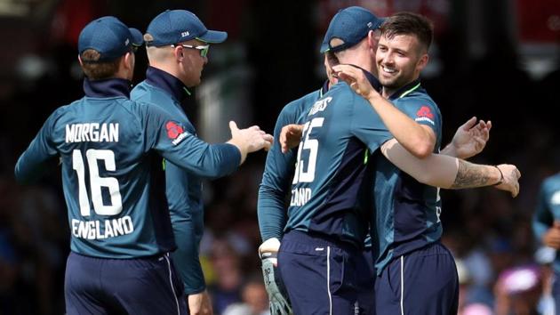 England's Mark Wood celebrates taking the wicket of India's Rohit Sharma. (REUTERS)