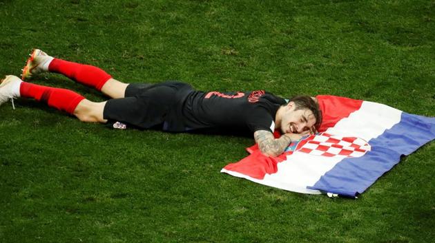 Croatia's Sime Vrsaljko celebrates with a flag after entering the FIFA World Cup 2018 final.(REUTERS)