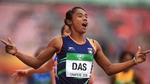 Indian athlete Hima Das celebrates after winning gold in the final of the women's 400m on day three of the IAAF World U20 Championships, in Tampere,(PTI)