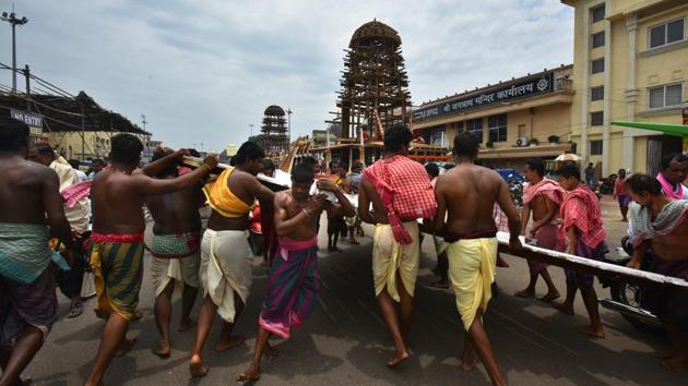 Local artists assemble the chariot ahead of Jagannath Rath Yatra, a popular festival which is celebrated in the month of July in Puri, Odisha. With roughly a fortnight left for the festival, the Grand Road in front of the Jagannath Temple is a site of frenzied activity. The hectic preparation traditionally starts from Basant Panchami with the arrival of the first load of wood to the temple. (Raj K Raj / HT Photo)