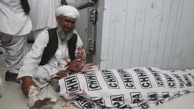 A man mourns next to a body of his family member killed in a bomb blast, in Quetta, Pakistan. (AP Photo) A man mourns next to a body of his family member killed in a bomb blast, in Quetta, Pakistan. (AP Photo)