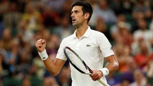 Novak Djokovic celebrates after winning a point during his Wimbledon semi-final against Rafael Nadal.(REUTERS)