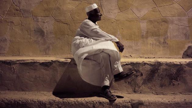 65-year old Mohammed Haroun sits in front of his home in Wadi Karkar. Young Nubian activists say that after the trauma of displacement, the older generation largely accepted whatever the government gave them. They say they are more determined to push for their rights and less willing to put up with discrimination. (Nariman El-Mofty / AP) 