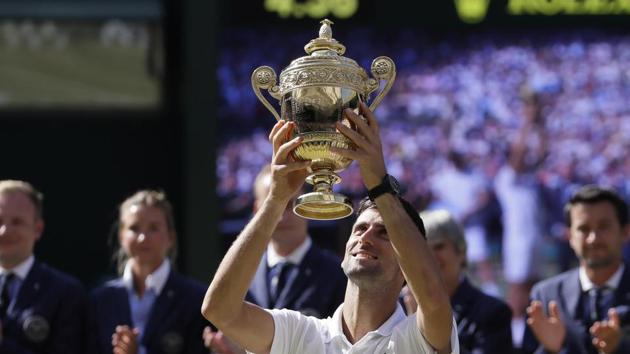 Novak Djokovic claimed his 13th Grand Slam and fourth Wimbledon crown with victory over Kevin Anderson in a largely one-sided men’s singles final at the All England Club. (AP)