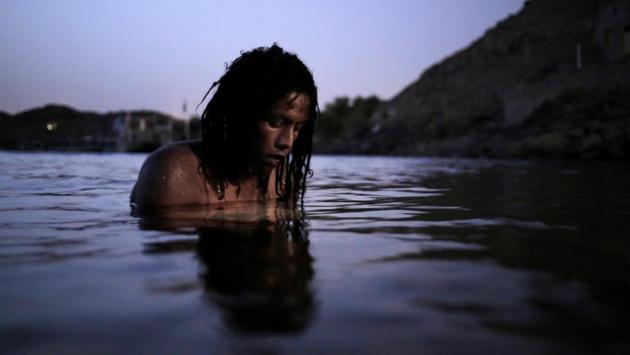 38-year old Reesha swims in the Nile River on Heisa Island. Older Nubians vividly recall life in their original land. They talk of sprawling villages with large houses painted in brilliant colours, with lands made fertile by sediment from annual floods. Most important was the bond with the Nile. They “baptized” their children in its waters. On holidays they set dishes to float away on its current. (Nariman El-Mofty / AP) 