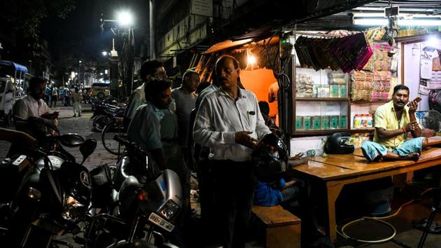 Choudhary (R) at his house as people gather to meet him at the Harishchandra ghat in the old quarters of Varanasi. “Some can barely afford the cremation,” he said. “Others make generous donations, and even offer to feed all the labourers.” He earns as little as 150 rupees ($2) for back-breaking labour that could last 18 hours. However, a good day could bring up to $75, said Choudhury. (Chandan Khanna / AFP) Choudhary (R) at his house as people gather to meet him at the Harishchandra ghat in the old quarters of Varanasi. “Some can barely afford the cremation,” he said. “Others make generous donations, and even offer to feed all the labourers.” He earns as little as 150 rupees ($2) for back-breaking labour that could last 18 hours. However, a good day could bring up to $75, said Choudhury. (Chandan Khanna / AFP)