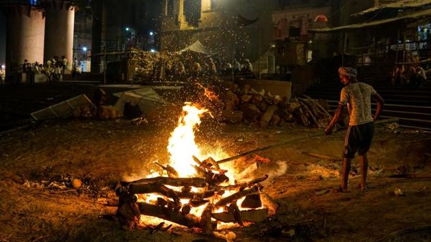 On the ghats, the Doms spend long hours surrounded by the heat of pyres and the swirling chaos synonymous with Varanasi. (Chandan Khanna / AFP) On the ghats, the Doms spend long hours surrounded by the heat of pyres and the swirling chaos synonymous with Varanasi. (Chandan Khanna / AFP)