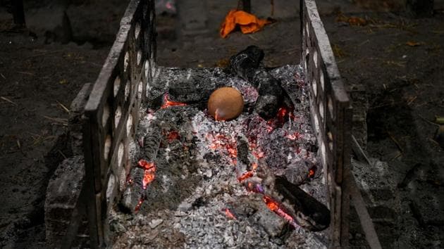 Some also sift for any valuables, including gold ornaments or even gold teeth left behind on the bodies by family members. Most within the marginalised community work are confined to menial jobs tending to the dead. (Chandan Khanna / AFP) Some also sift for any valuables, including gold ornaments or even gold teeth left behind on the bodies by family members. Most within the marginalised community work are confined to menial jobs tending to the dead. (Chandan Khanna / AFP)
