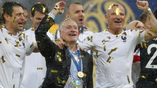 France coach Didier Deschamps celebrates with France staff after winning the World Cup 2018 title on Sunday.(REUTERS)