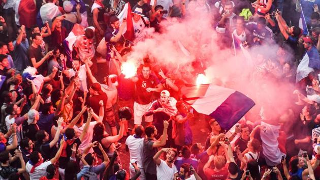 This picture taken from the terrace of the Publicis drugstore on July 15, 2018 shows people celebrating France's victory in the Russia 2018 World Cup final football match between France and Croatia, on the Champs-Elysees avenue in Paris. (AFP) This picture taken from the terrace of the Publicis drugstore on July 15, 2018 shows people celebrating France's victory in the Russia 2018 World Cup final football match between France and Croatia, on the Champs-Elysees avenue in Paris. (AFP)