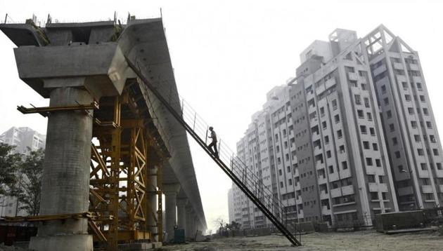 A worker climbs up to a pillar of a metro railway under construction in Kolkata February 9, 2015.(Reuters File Photo)